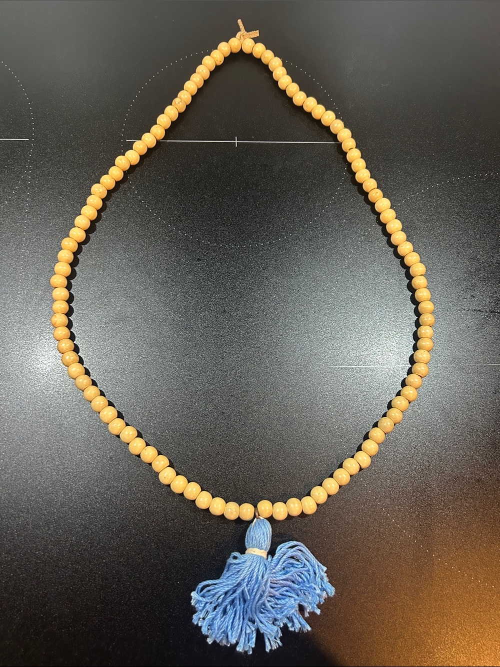 Handmade Beige Wood Bead Necklace with Blue Tassel
